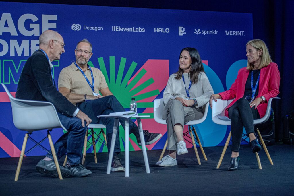 Martin Hill-Wilson moderating a panel of CX leaders on the main stage