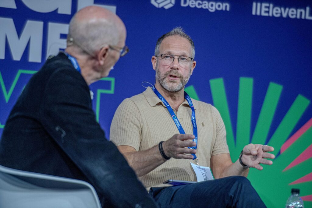 A speaker answering a question from Martin Hill-Wilson on the main stage
